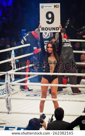 KYIV, UKRAINE - DECEMBER 13, 2014: Boxing ring girl holding a board with round number during WBO Intercontinental cruiserweight Title fight Oleksandr Usyk vs Danie Venter