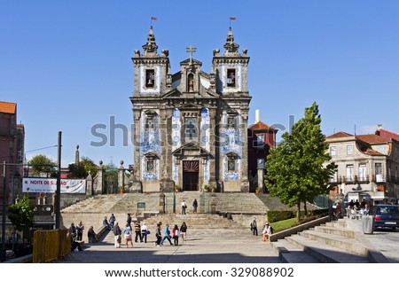 PORTO, PORTUGAL - JUNE 19, 2013: Church of Saint Ildefonso (Igreja de Santo Ildefonso), a 18th century building in Baroque style, covered with typical Portuguese tiles (Azulejos), Porto city, Portugal