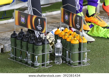 LVIV, UKRAINE - March 10, 2016: Bottles of water with UEFA Europa League logo on the grass during UEFA Europa League Round of 16 game FC Shakhtar Donetsk vs RSC Anderlecht at Arena Lviv stadium