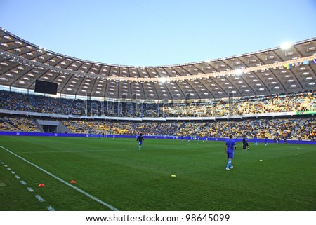 KYIV, UKRAINE - MARCH 18: Players run during training session before Ukraine Championship game between FC Dynamo Kyiv and FC Dnipro at NSC Olimpiyskiy stadium on March 18, 2012 in Kyiv, Ukraine