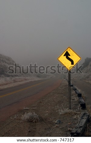 Twisting road through Lake Pueblo State Park on foggy morning