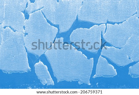 Broken ice background as a concept of blue frigid cold temperatures as in the arctic polar climate with chunks of below zero frozen water representing cool refrigerated environment.