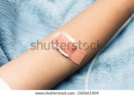 arm covered plaster after drawn blood