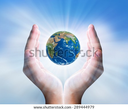 Hands is holding small earth