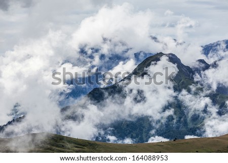 Dolomites after the storm - peaks in the clouds