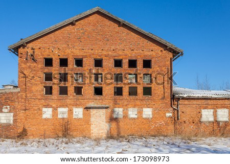 Ruined brick factory at sunset in winter