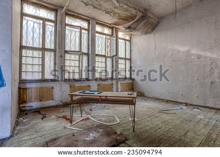 Destroyed interior with barred windows