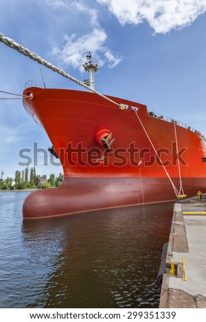 The huge red ship moored in the yard