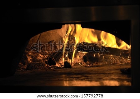 Flaming wood inside a pizza oven at a Washington DC restaurant