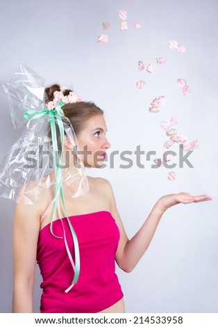 Young woman throws a candy, marshmallow, makeup style beauty fantasy. Young woman with a gentle make-up and hairstyle, decorated with candy. Candy-girl package, candy makeup