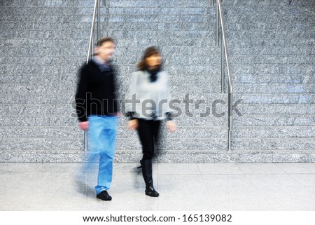 Consumer Walking Up Stairs, Motion Blur