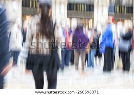 Blurred pedestrian in the city, zoom effect, motion blur