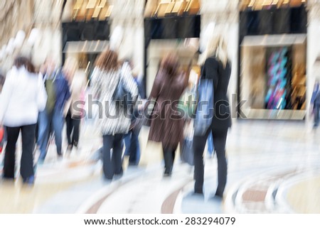 Blurred pedestrian in the city, zoom effect, motion blur