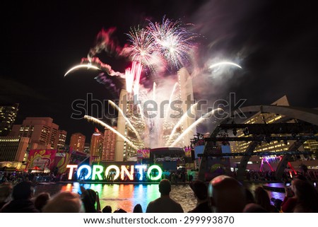 TORONTO - JULY 21, 2015:\
Fireworks are launched celebrating the Pan Am Games at Nathan Phillips Square in Toronto.  The Toronto 2015 Pan-Am Games are a major international multi-sport event.