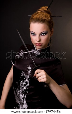 The girl in a black kimono with a dagger