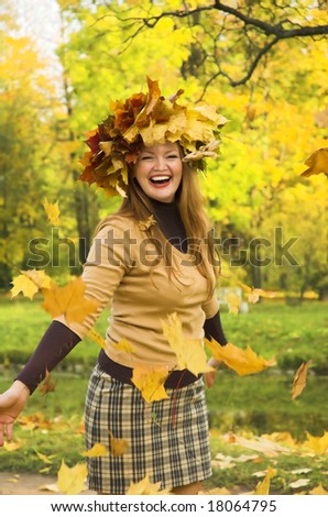 The cheerful girl on rest in autumn park