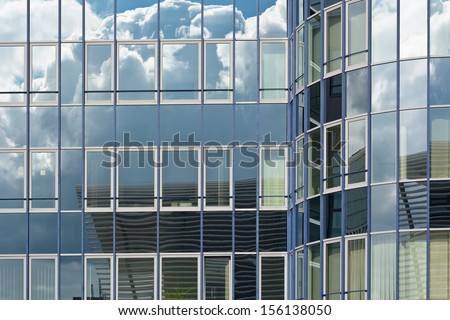 Contemporary Architecture with Sky and Cloud Reflection
