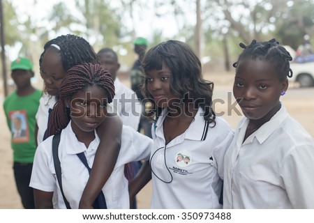 NAMPULA, MOZAMBIQUE - OCTOBER 4, 2014: African girls in school uniform. Daily scenes from northern Mozambique