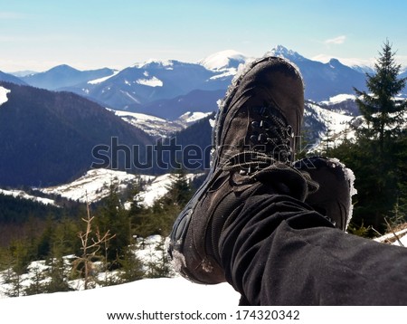 Hiking boots, relax on the top of mountain