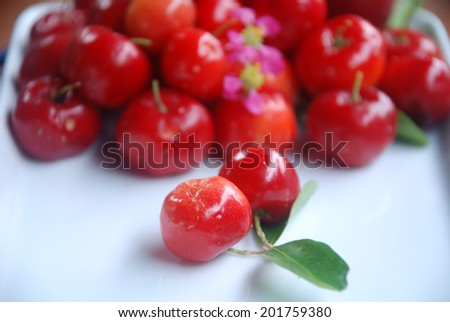 Small red fruit . Brazilian Acerola Fruit . small cherry