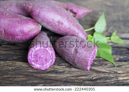 purple sweet potato on wooden background.