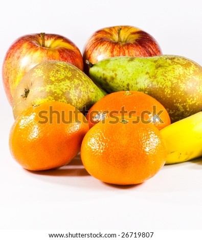 Fruits varied with mandarins in first plane on white background