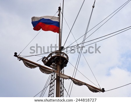 Lookout post in a boat with Russian flag on a gray day