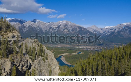 Bird view of the bow valley and mountains in lights and shadows near the town canmore, banff national park, alberta, canada