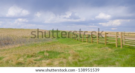 farmers field with rain clouds as background, Alberta, Canada