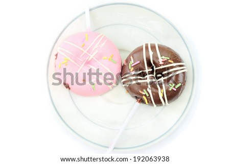 Chocolate and pink donut on white background / Chocolate and pink donut