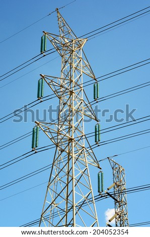 Power transmission lines against blue sky / Power transmission lines