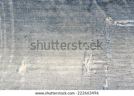 Blue torn jeans texture with damage / Blue torn jeans texture