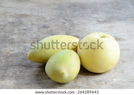 Chinese pear and Ripe Mangoes on wooden background /Chinese pear and Ripe Mangoes