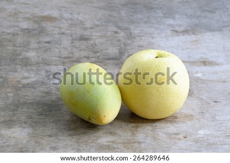 Chinese pear and Ripe Mango on wooden background /Chinese pear and Ripe Mango