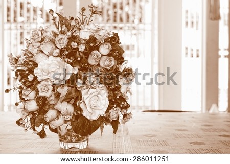 Vintage tone of plastic flowers in glass vase / Group of plastic flowers