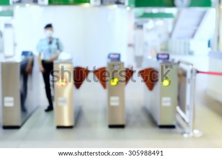 Blurred of Ticket Checker with security guard at BTS skytrain station