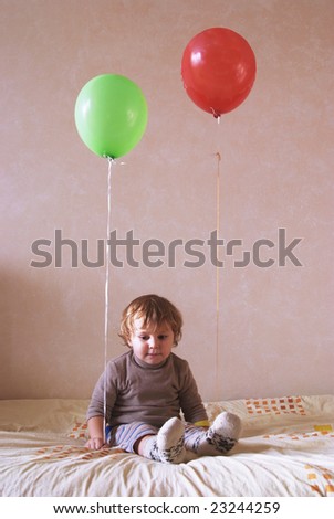 lonely child with balloons