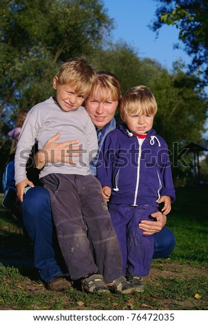 Family of mother and two sons in casual clothes
