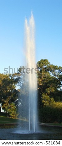 Tall fountain shoots jet of water into air