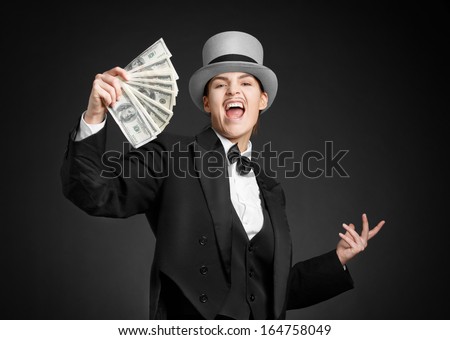 Woman with a bundle money in his hand. Gangster girl keeps money in hands