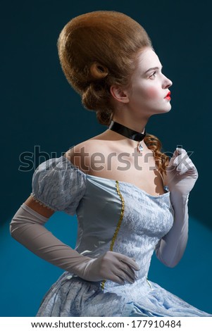 Theatre. Fairy Tale. Fancy woman in a blue dress - Retro Hairstyle. Medieval Fantasy.