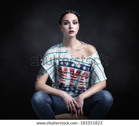 Portrait of a girl in a T-shirt with the inscription \