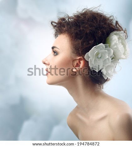 Fashion Beauty Model Girl with Flowers Hair. Bride. Perfect Make up and Hair Style. Hairstyle.