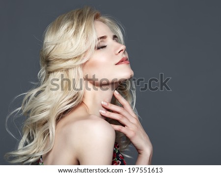 Beauty Portrait. Beautiful Woman Touching her neck. Perfect Fresh Skin. Isolated on Grey Background. Pure Beauty Model. Youth and Skin Care Concept