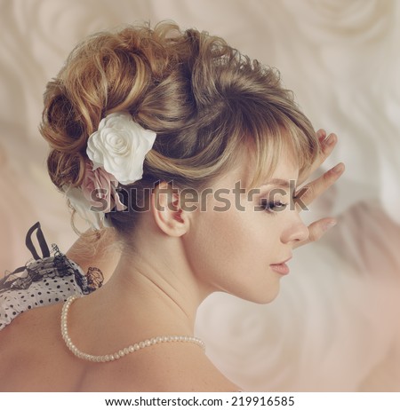 Beautiful bride with a wreath of roses. Updo. Wedding makeup. Instagram style.