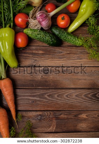 Fresh vegetables on a wooden table. Rustic style. Vegetarianism. Organic food. Space for text.
