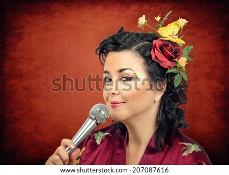 Flowers haired kimono caucasian woman singing karaoke. Portrait on grunge background