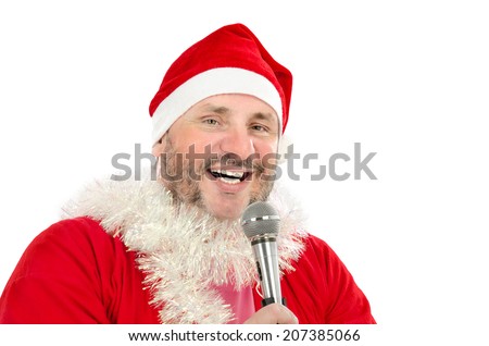 Perky mature fat man in Santa Claus costume singing Christmas songs with microphone