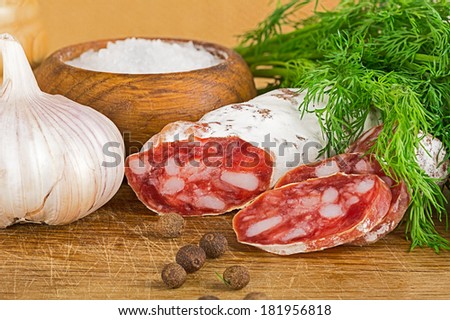 sliced salame on cutting board, Focus area increased by folding multiple photos