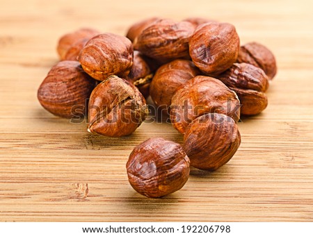 Pile of dried hazelnuts . Images collected from four shots to increase the zone of sharpness